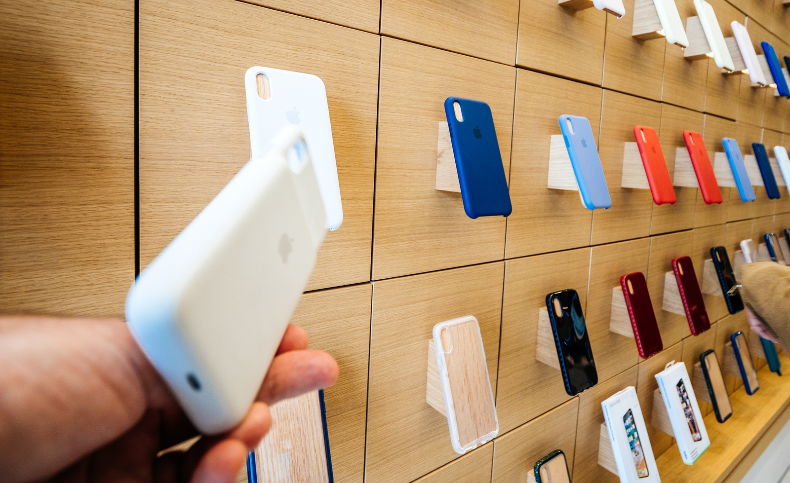 Paris, France - Circa 2019: Apple iPhone XS protection Smart Battery Case product displayed inside the new Apple Store Champs-Elysees largest French store located in the heart of the capital people testing