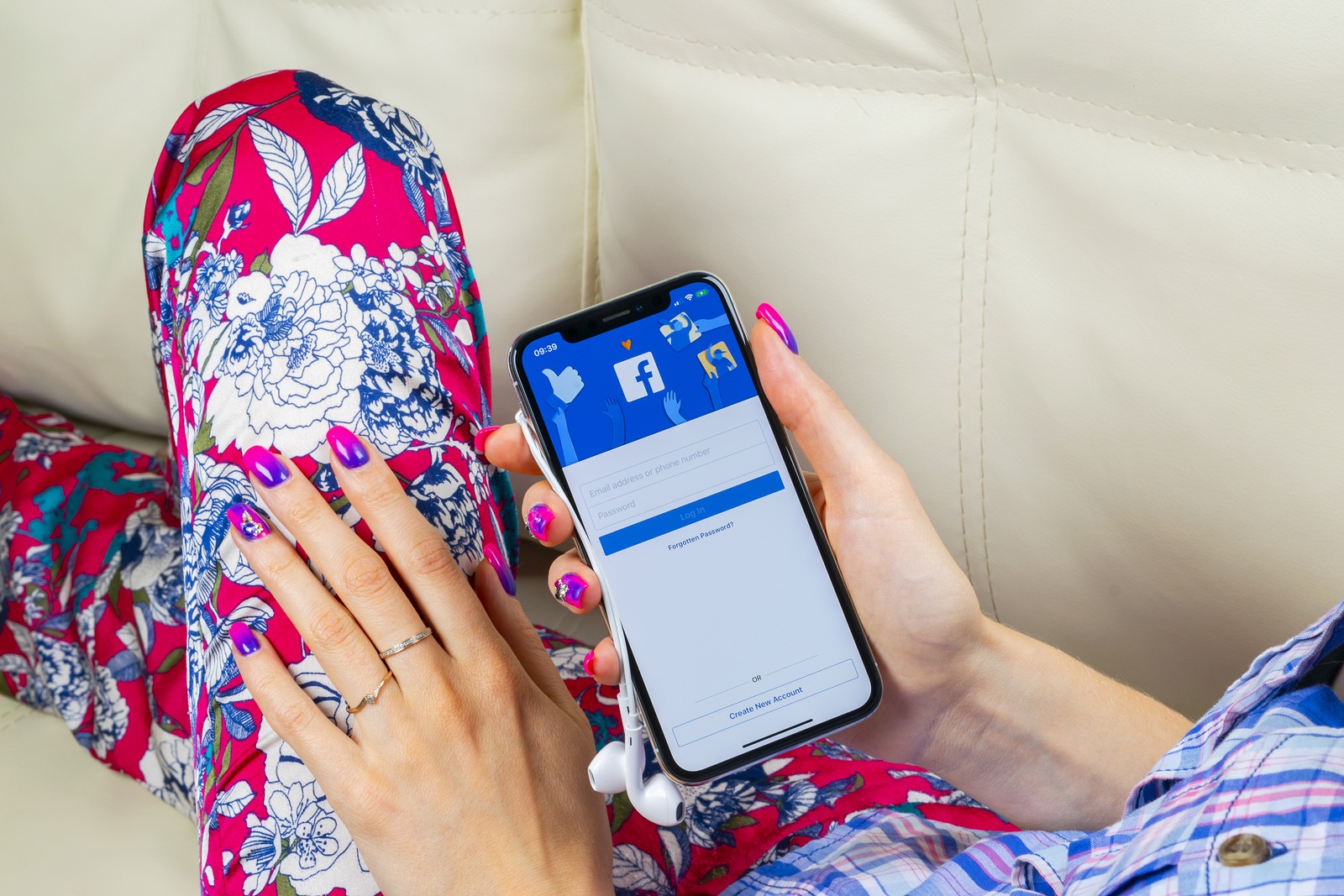 Sankt-Petersburg, Russia, June 8, 2018: Facebook application icon on Apple iPhone X smartphone screen close-up in woman hands. Facebook app icon. Social media icon. Social network