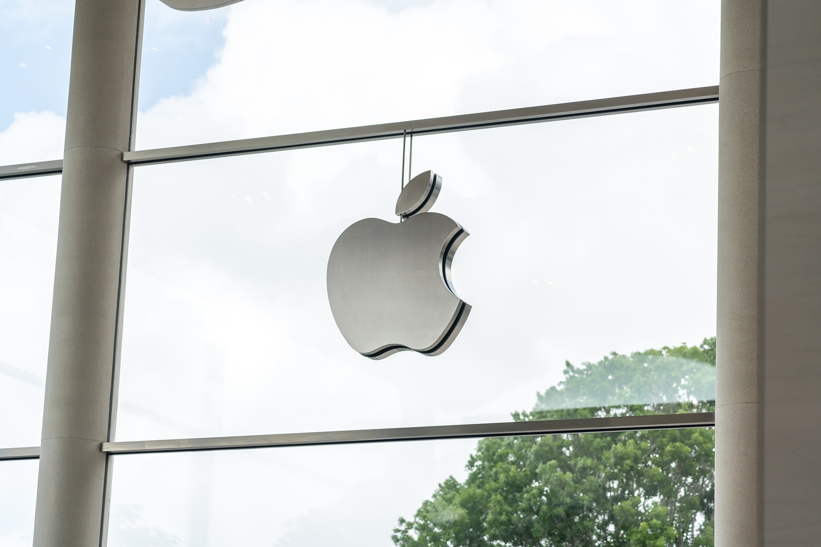 Aventura, Florida, USA - September 20, 2019: Apple store logo in Aventura Mall. It is the worlds largest publicly traded company designs and sells consumer electronics and computer products.