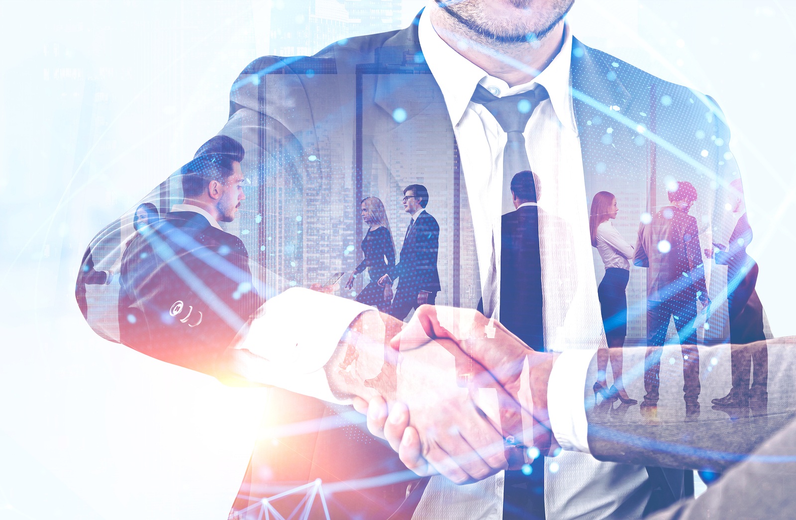 Handshake of business people with double exposure of their team working in office. Global digital network hologram. Concept of technology and international business. Toned image