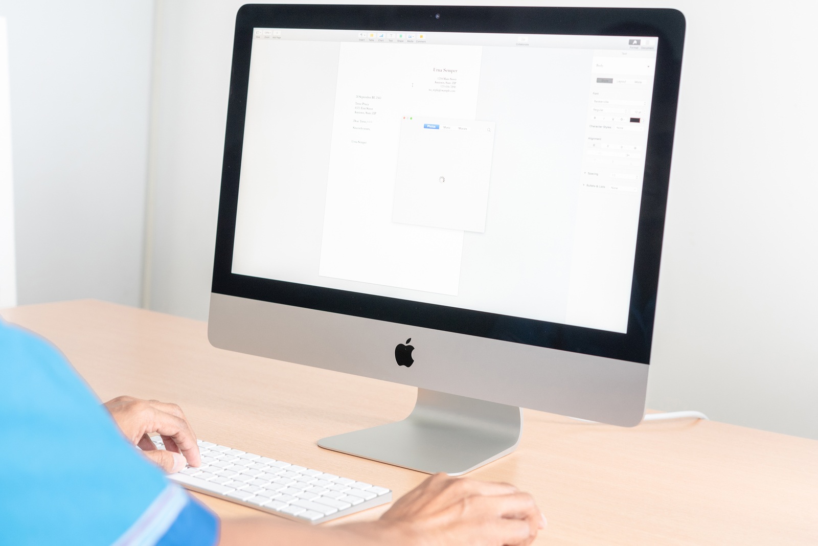 PHATTHALUNG, THAILAND - September 28, 2018: iMac computer, keyboard, magic mouse on wooden table, created by Apple Inc.