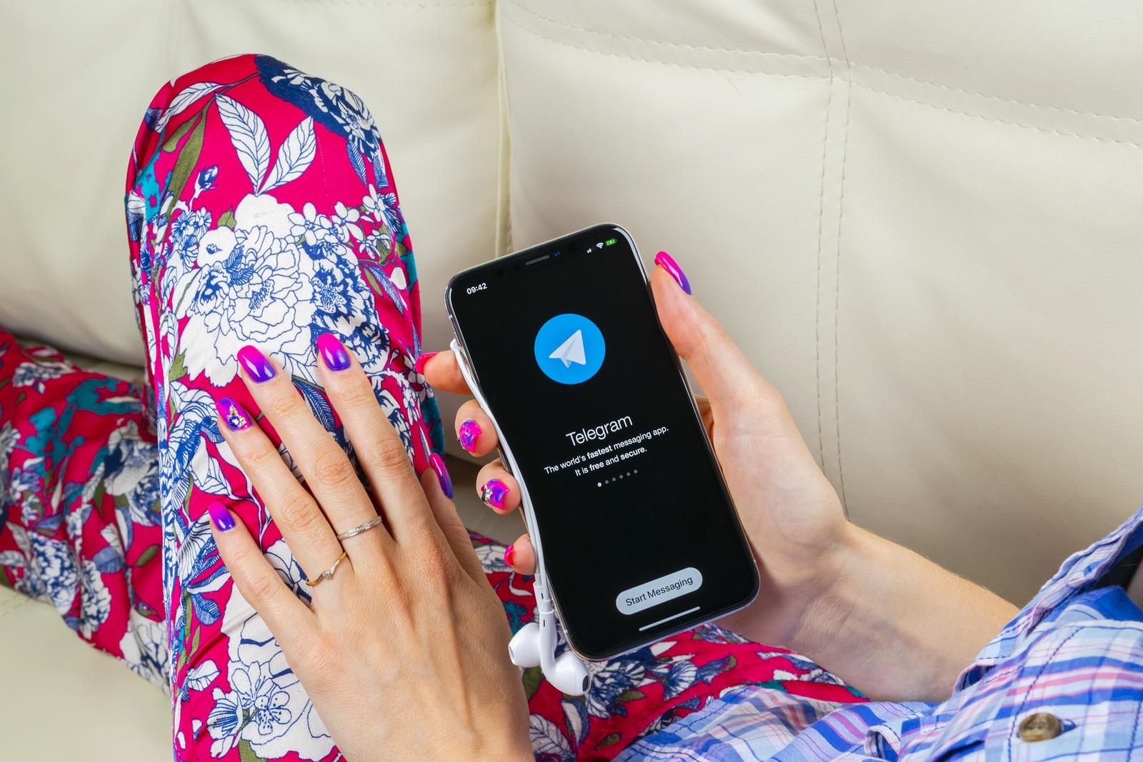 Sankt-Petersburg, Russia, June 8, 2018: Telegram X application icon on Apple iPhone X screen in woman hands. Telegram X app icon. Telegram X is an online social media network. Social media app