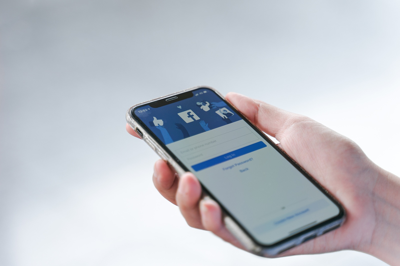 CHIANG MAI, THAILAND - Jul.27,2019: Woman holding Apple iPhone X with facebook app on the screen. Facebook is one of the most popular social media service app on the world.