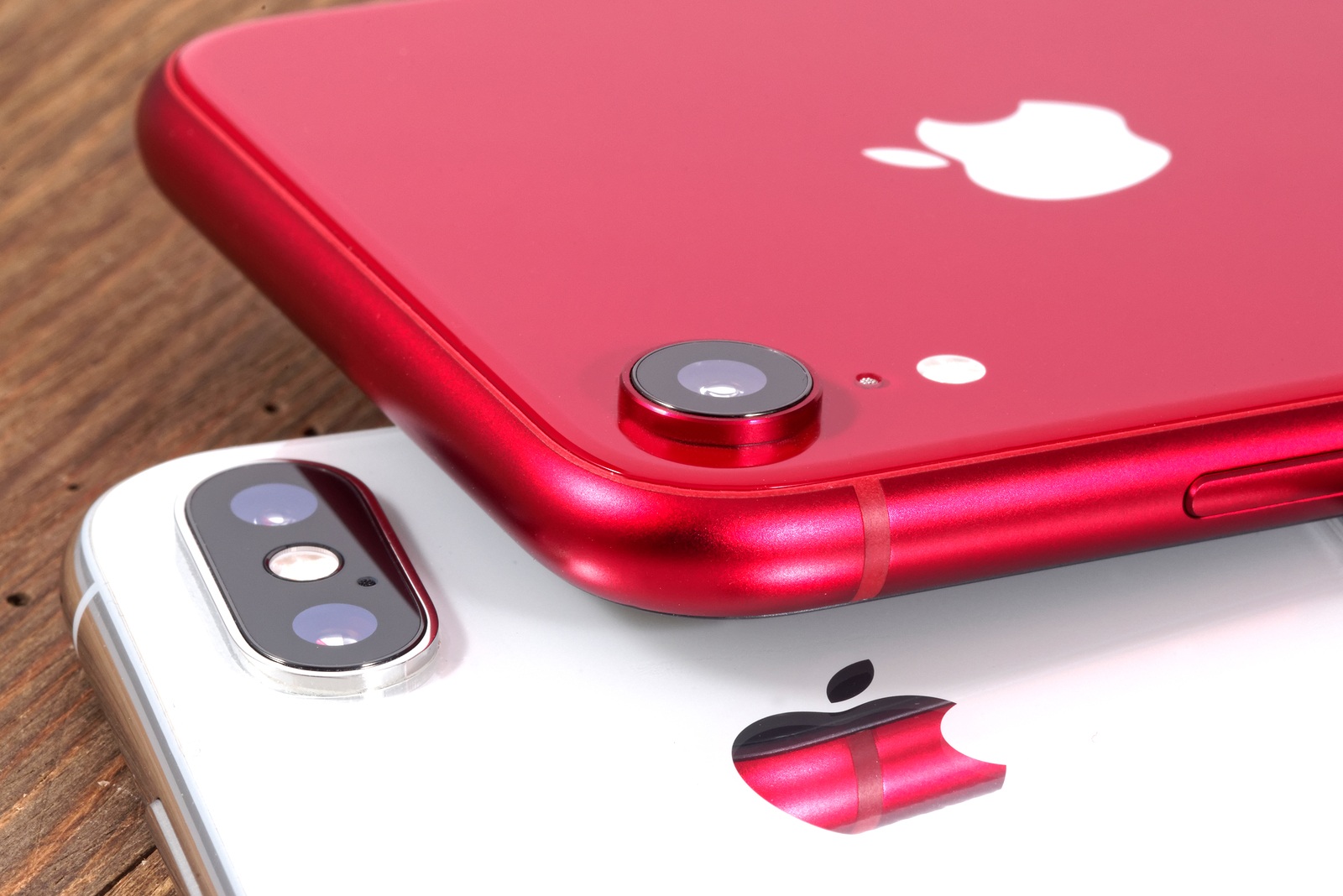 Koszalin, Poland - November 29, 2018: Silver iPhone Xs and red iPhone XR. The iPhone Xs and iPhone XR is smart phone with multi touch screen produced by Apple Computer, Inc.