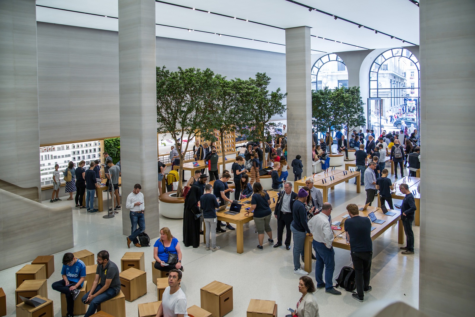 London, UK - August 13, 2019: Interior of the Apple stope. Lots of people inside the  Apple Store on Regent Street, Regent Street was Apples first store in Europe.