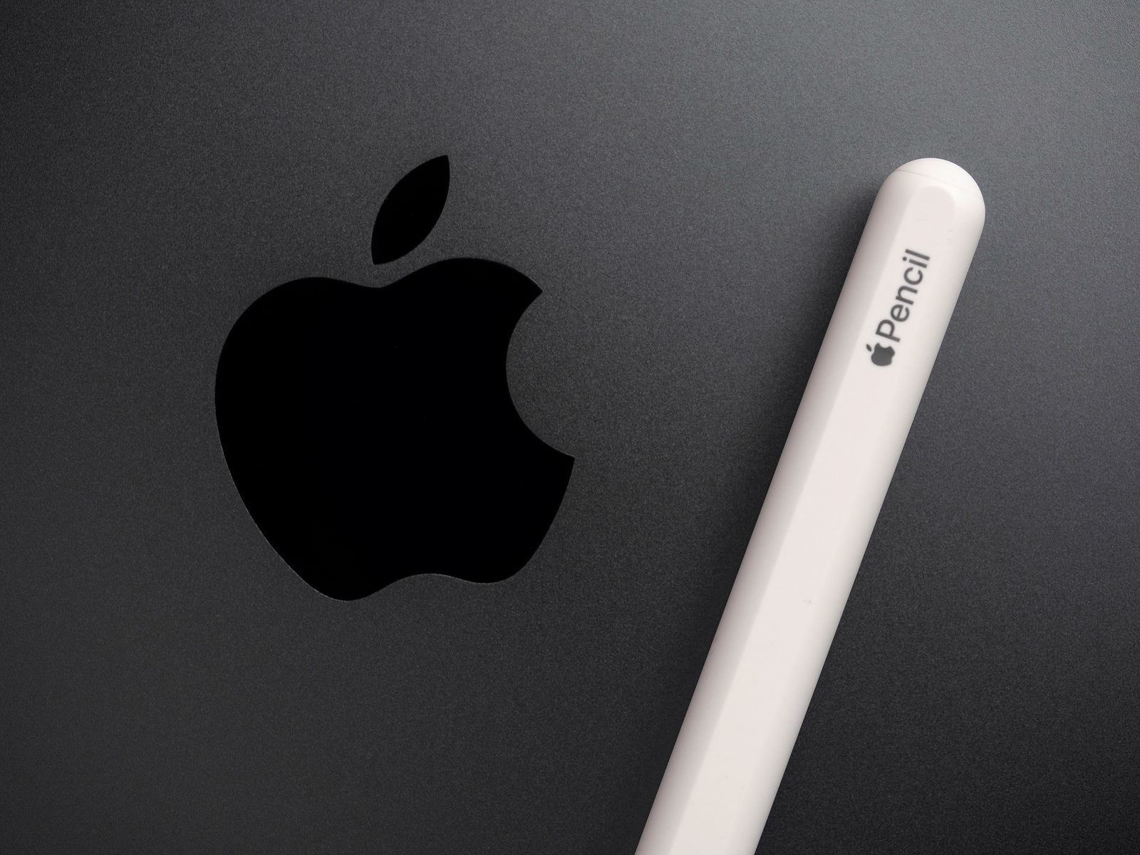 Chiang Rai, Thailand: September 12, 2019 - Close up and top view image of New Apple Pencil with Apple logo of iPad Pro 11 inch 2018.