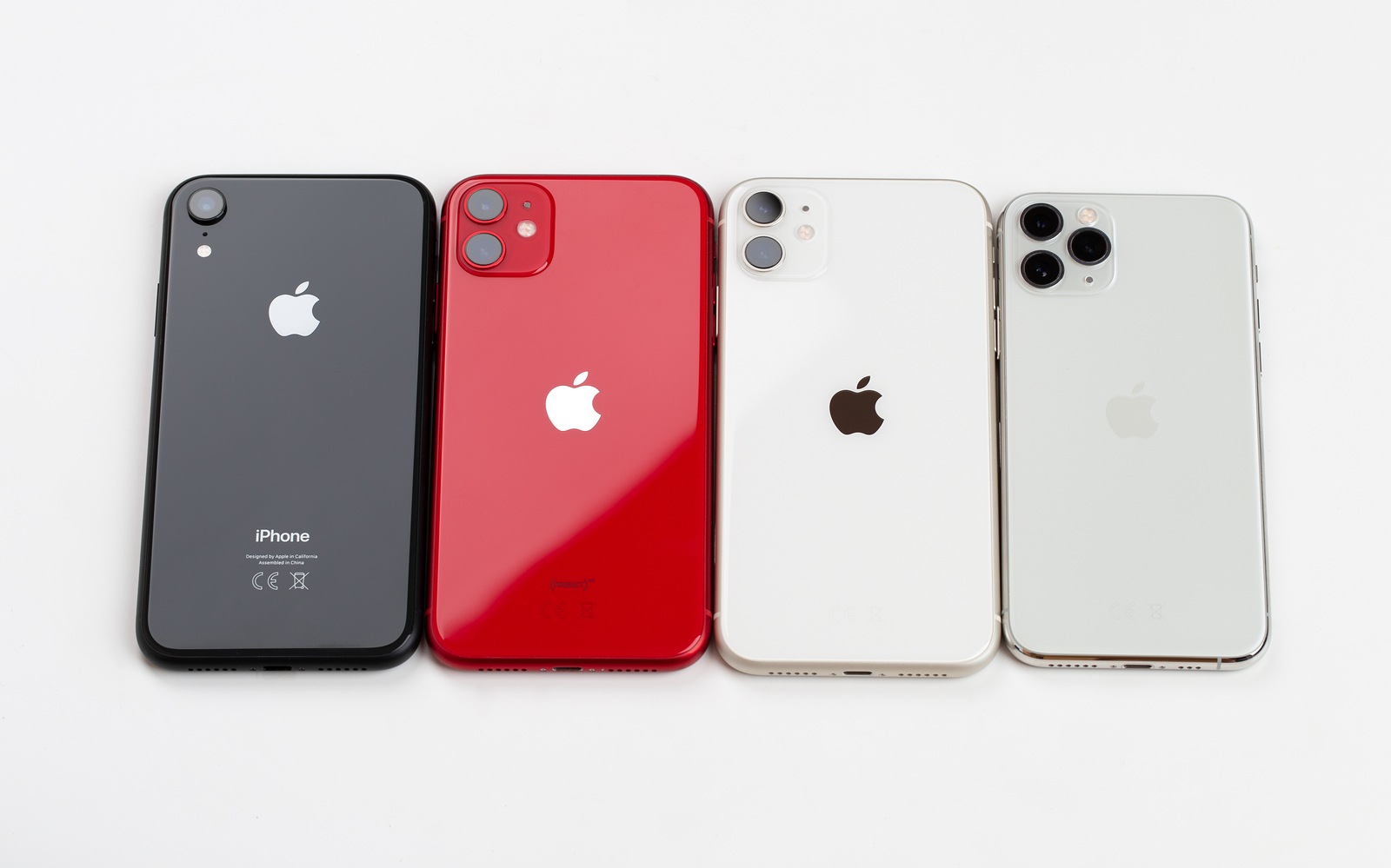 Rostov-on-Don, Russia - November 2019. Apple iPhone 11 Red, iPhone 11 Pro silver, iPhone 11 Silver and Apple iPhone XR black on a white background.Smartphones from the company Apple close-up.