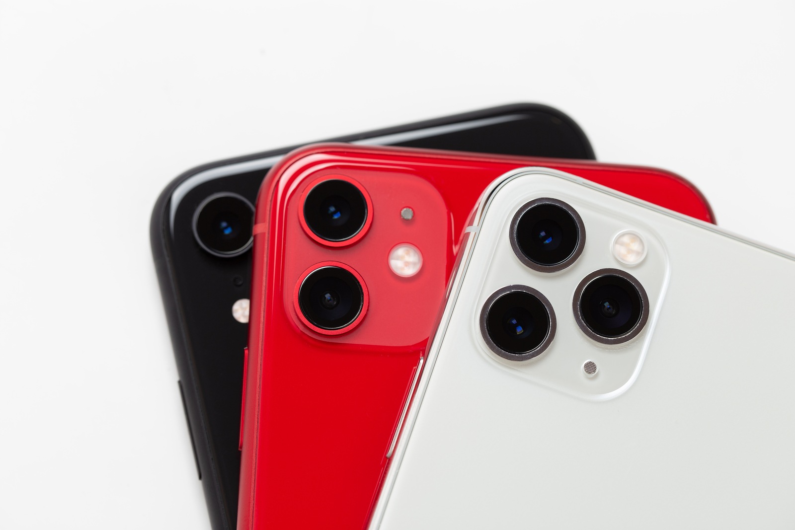 Rostov-on-Don, Russia - November 2019. Apple iPhone 11 Red, Apple iPhone 11 Pro silver and Apple iPhone XR black on a white background. New smartphones from the company Apple close-up.