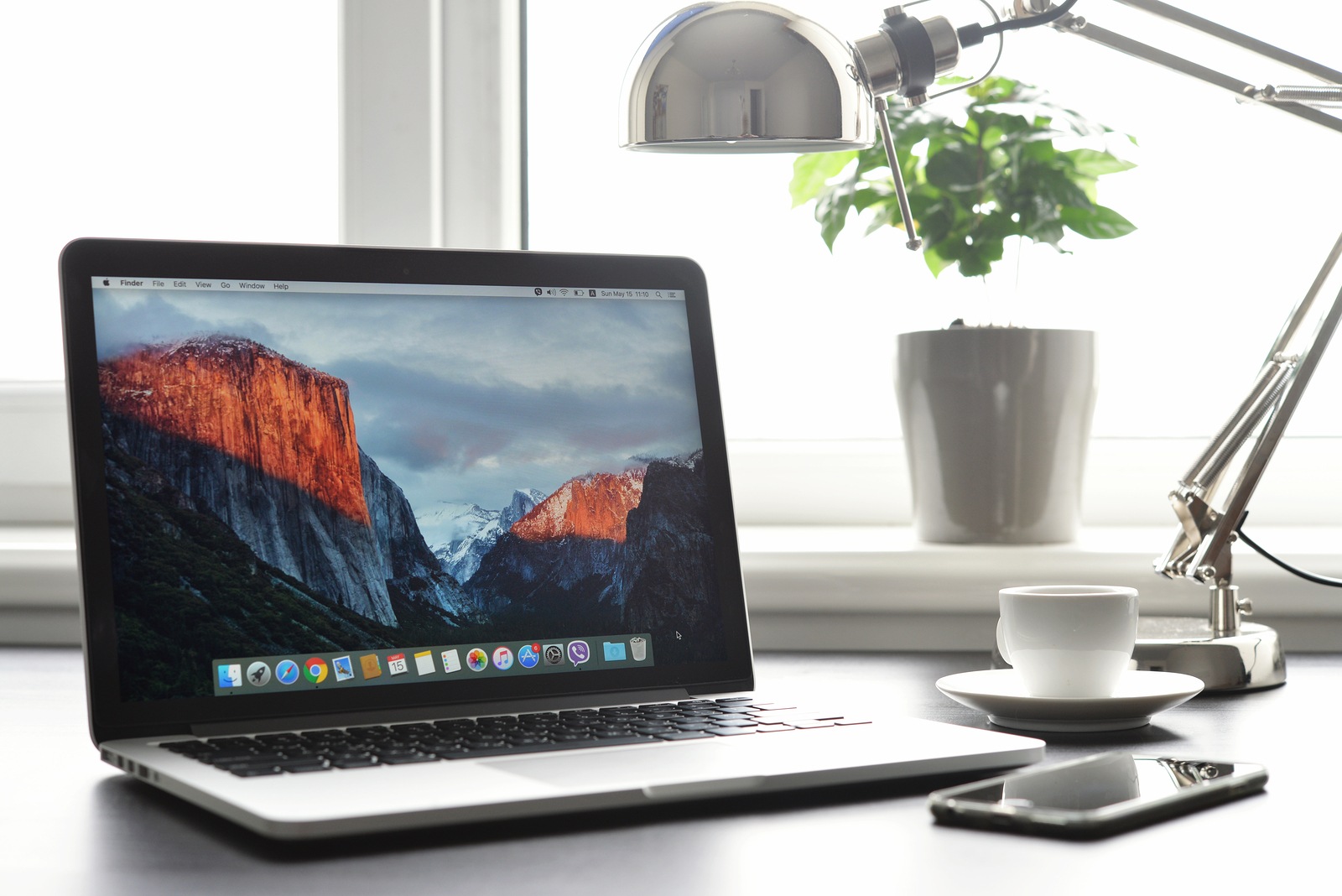 Kiev Ukraine - May 15 2016:Brand new Macbook Pro with with Retina display and OS X EL Capitan on table. MacBook is a brand of notebook computers manufactured by Apple Inc.