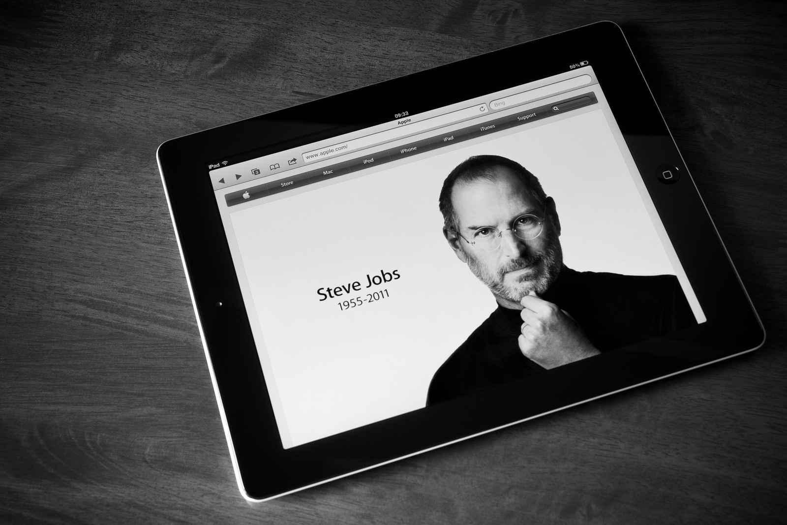 Kiev Ukraine - October 06 2011: Steve Jobs founder of Apple Computers has died at the age of 56 years. Photo of the founder on the website apple.com shown on the Apple Ipad2 device. Processed in BW.