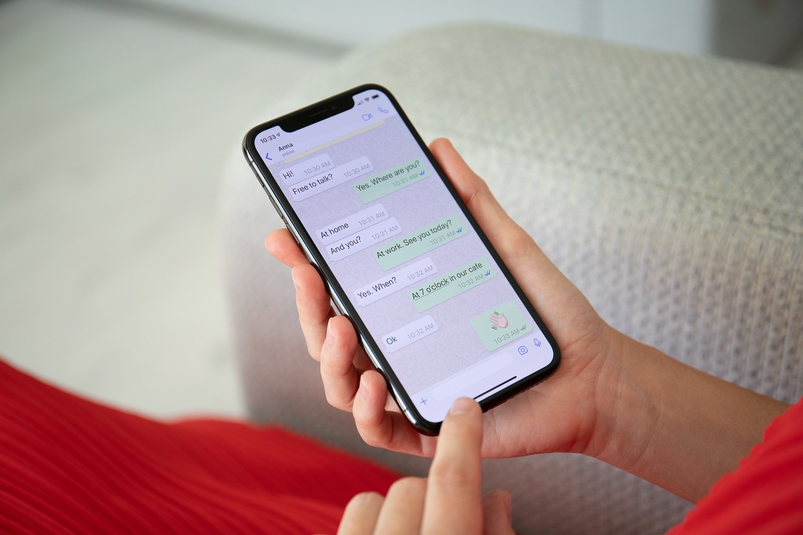 Alushta, Russia - September 27, 2018: Woman holding iPhone X with social networking service WhatsApp on the screen. iPhone 10 was created and developed by the Apple inc.