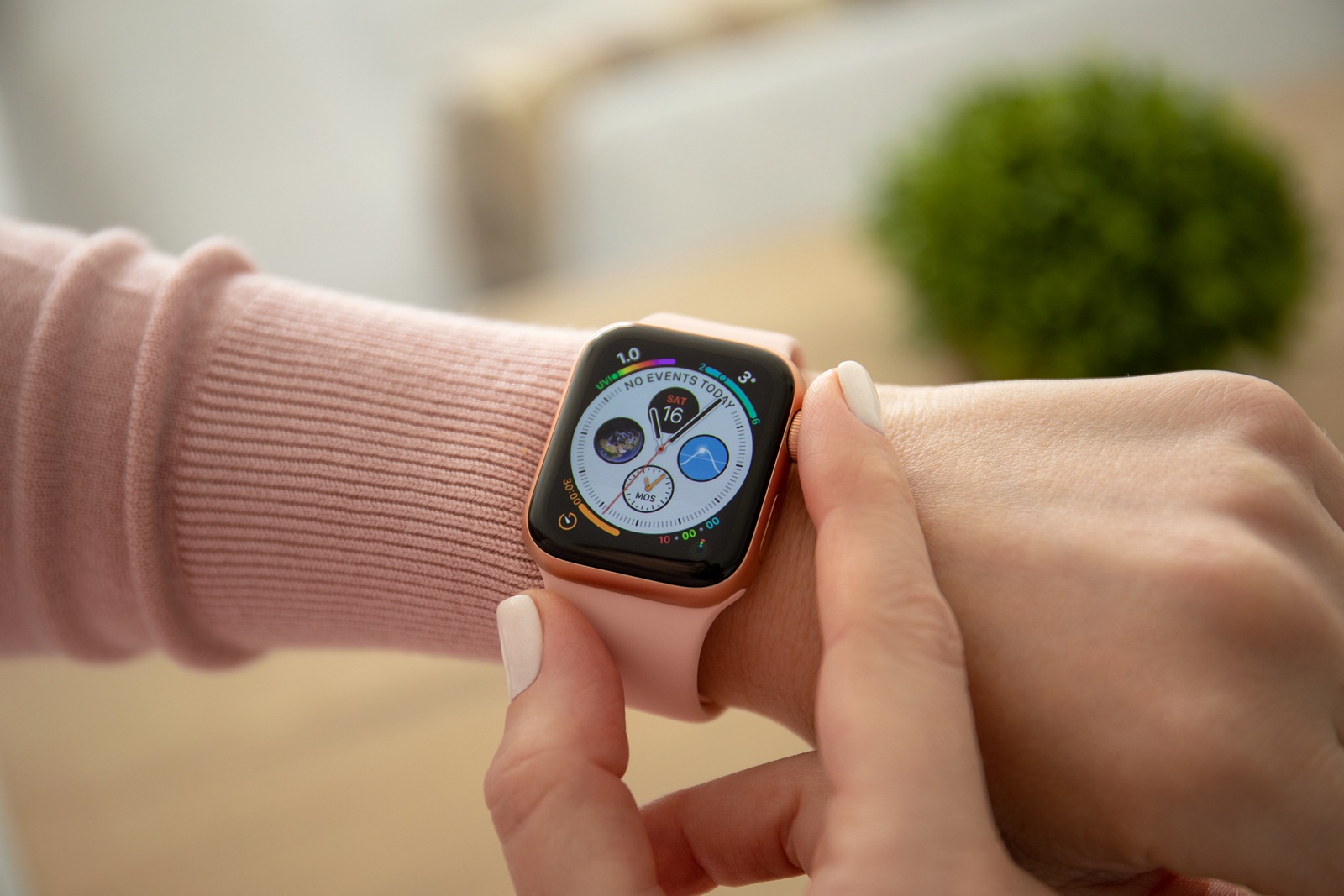 Anapa, Russia - February 16, 2019: Woman hand with Apple Watch Series 4 and finger touching screen. Apple Watch was created and developed by the Apple inc.