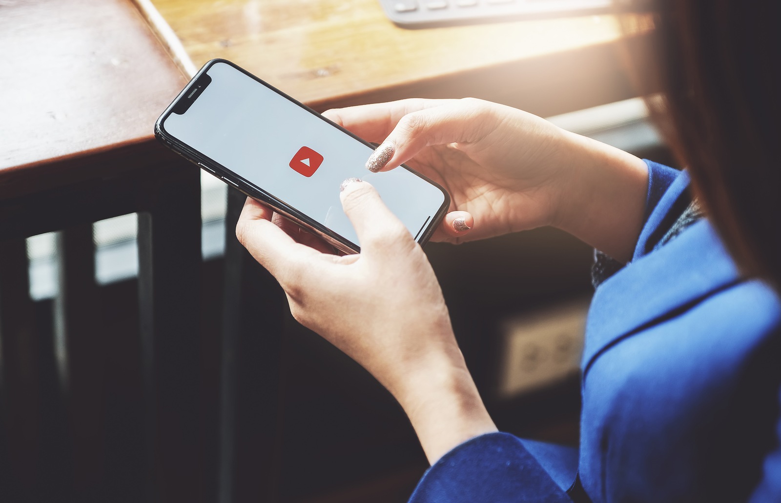 CHIANG MAI,THAILAND - Feb 16, 2019: A woman showing screen shot of Youtube on iphone x,  YouTube app on the screen, YouTube is the popular online video sharing website. - Image