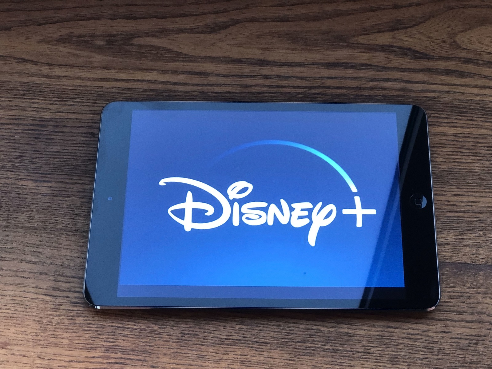 December 2019 Parma, Italy: Disney + company logo icon on tablet screen close-up. Disney+ video streaming service and visual brand