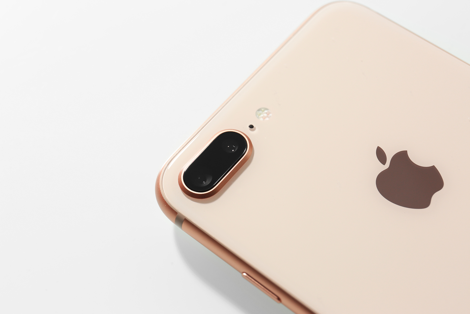 KIEV, UKRAINE - OCTOBER 23, 2017: Back panel of iPhone 8 Plus Gold on light background, closeup