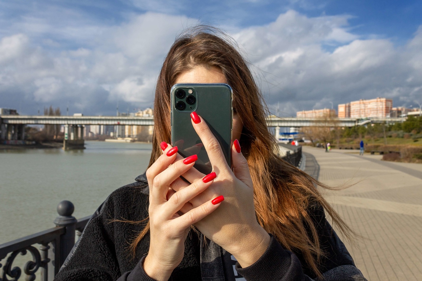 Krasnodar, Russia - January 29, 2020: a girl takes a photo or video on an Apple iPhone 11 Pro smartphone with triple-lens camera