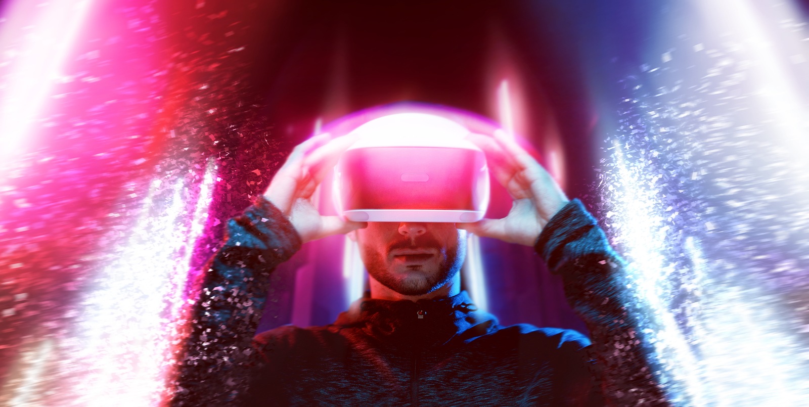 Model young man with beard in glasses of virtual reality. Augmented reality, science, future technology, people concept. VR. Futuristic 3d glasses with virtual projection. Neon light.