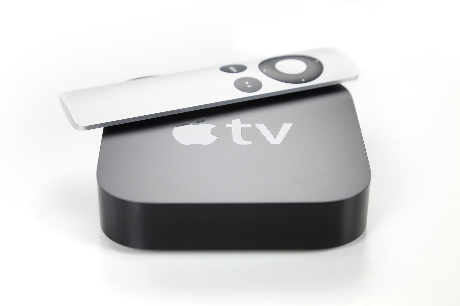 Adelaide, Australia - January 27, 2015: View of a third generation Apple TV and its remote control. The Apple TV is a digital media player developed by Apple Inc.