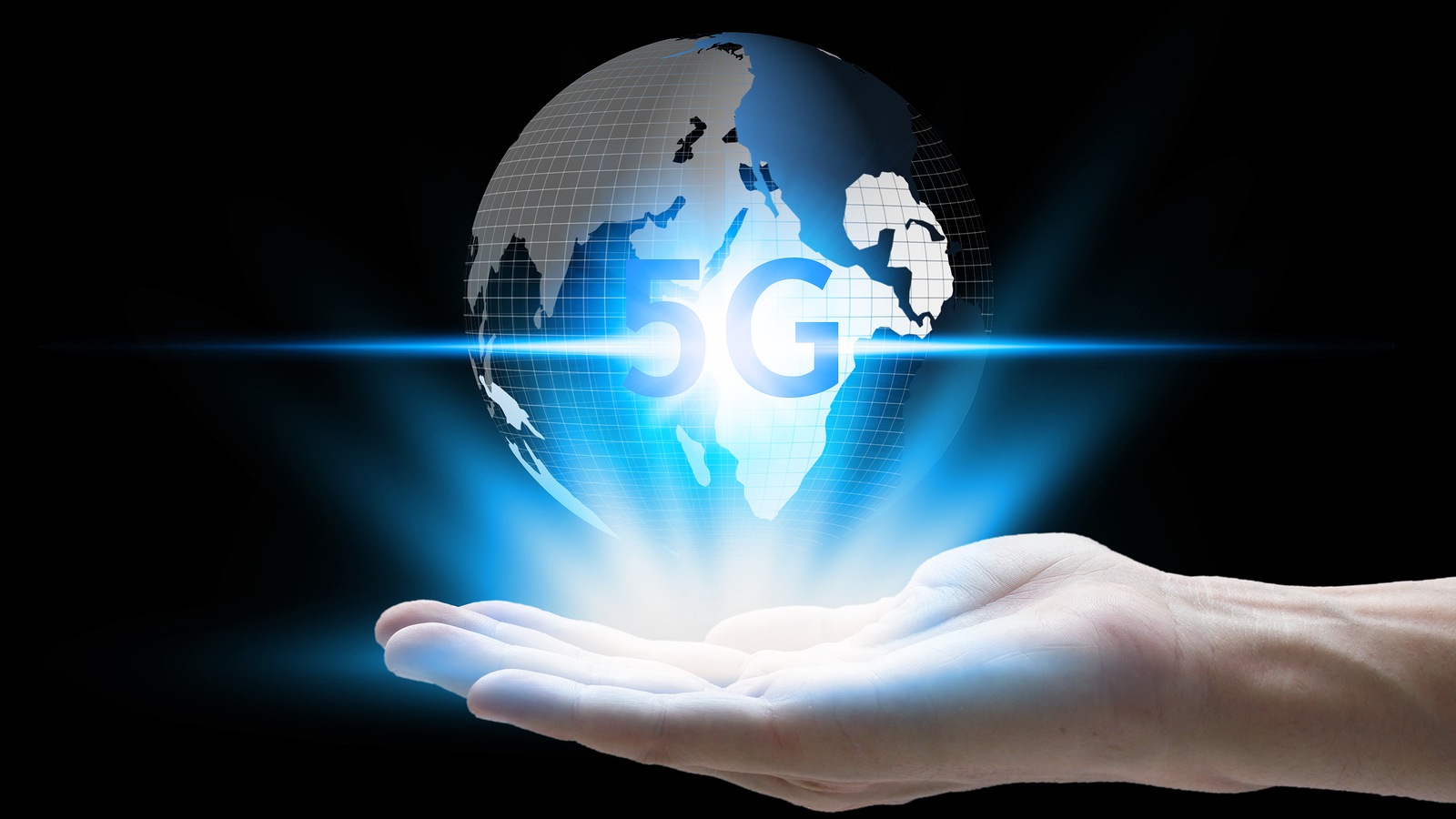 hand holding network using 5G technology with virtual screen icons on a black background, Technology Internet 5G global network concept.