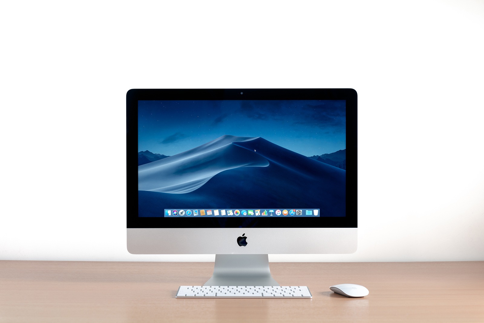 PHATTHALUNG, THAILAND - September 28, 2018: iMac computer, keyboard, magic mouse on wooden table, created by Apple Inc.