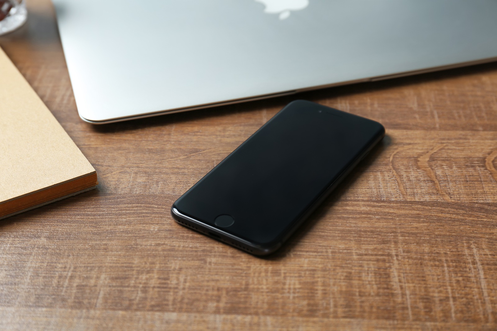 KYIV, UKRAINE - DECEMBER 18, 2017: Modern iPhone 8 Space Gray on wooden table