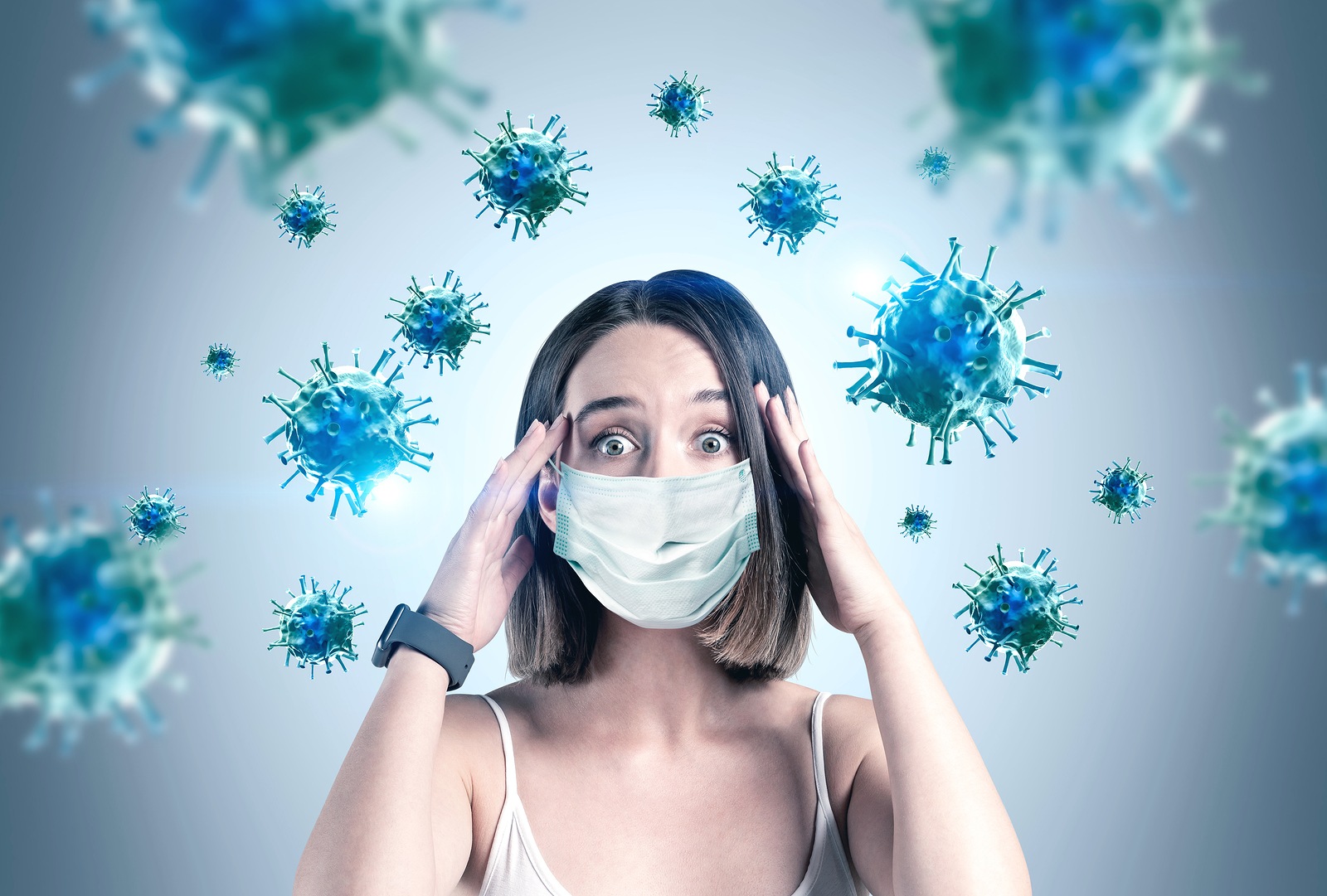 Scared young woman in medical mask standing over gray background with blurry red virus molecules. Concept of coronavirus and Asian flu panic. Toned image