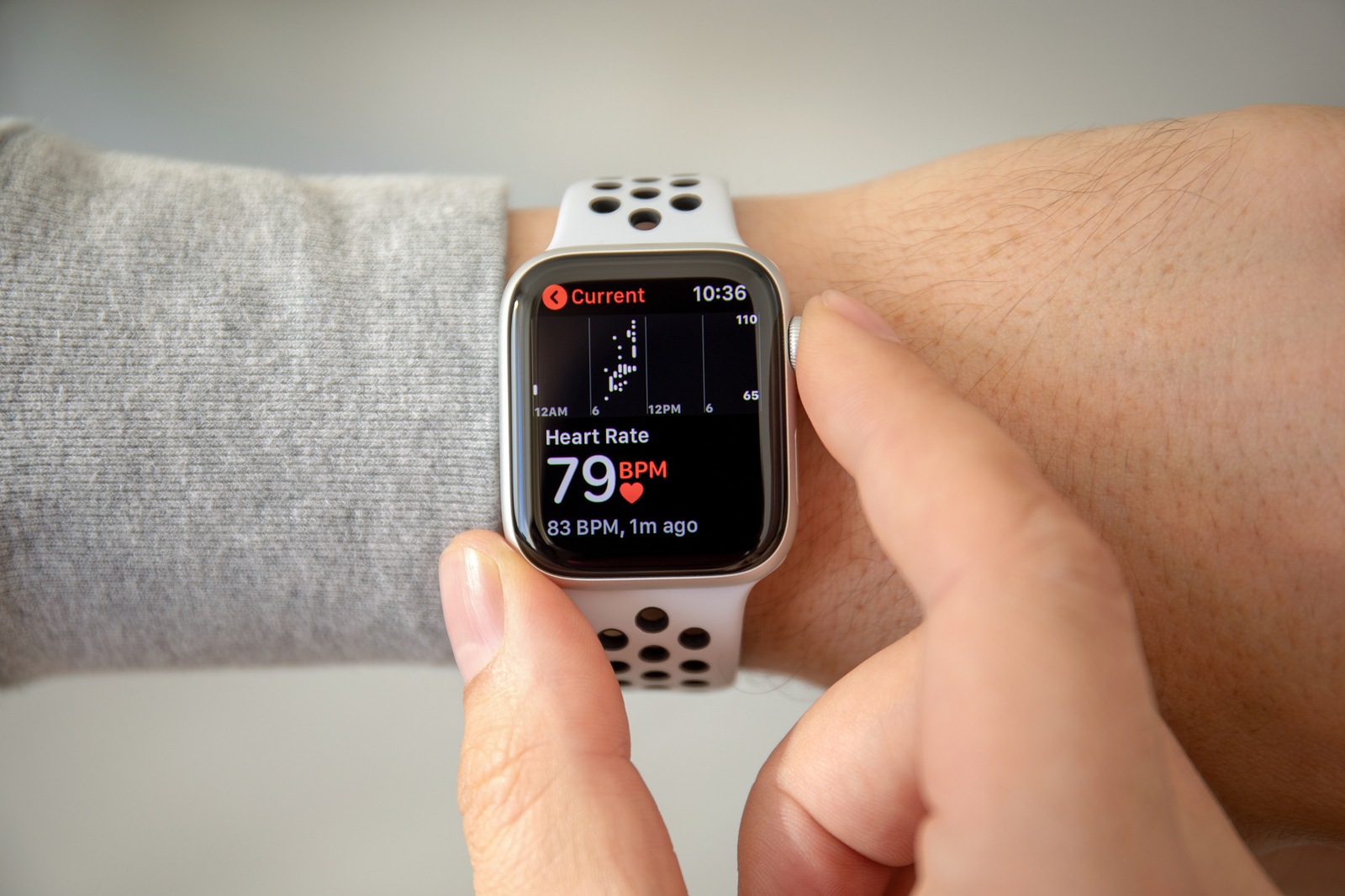 Alushta, Russia - November 6, 2018: Man hand with Apple Watch Series 4 with Heart Rate on the screen. Apple Watch was created and developed by the Apple inc.