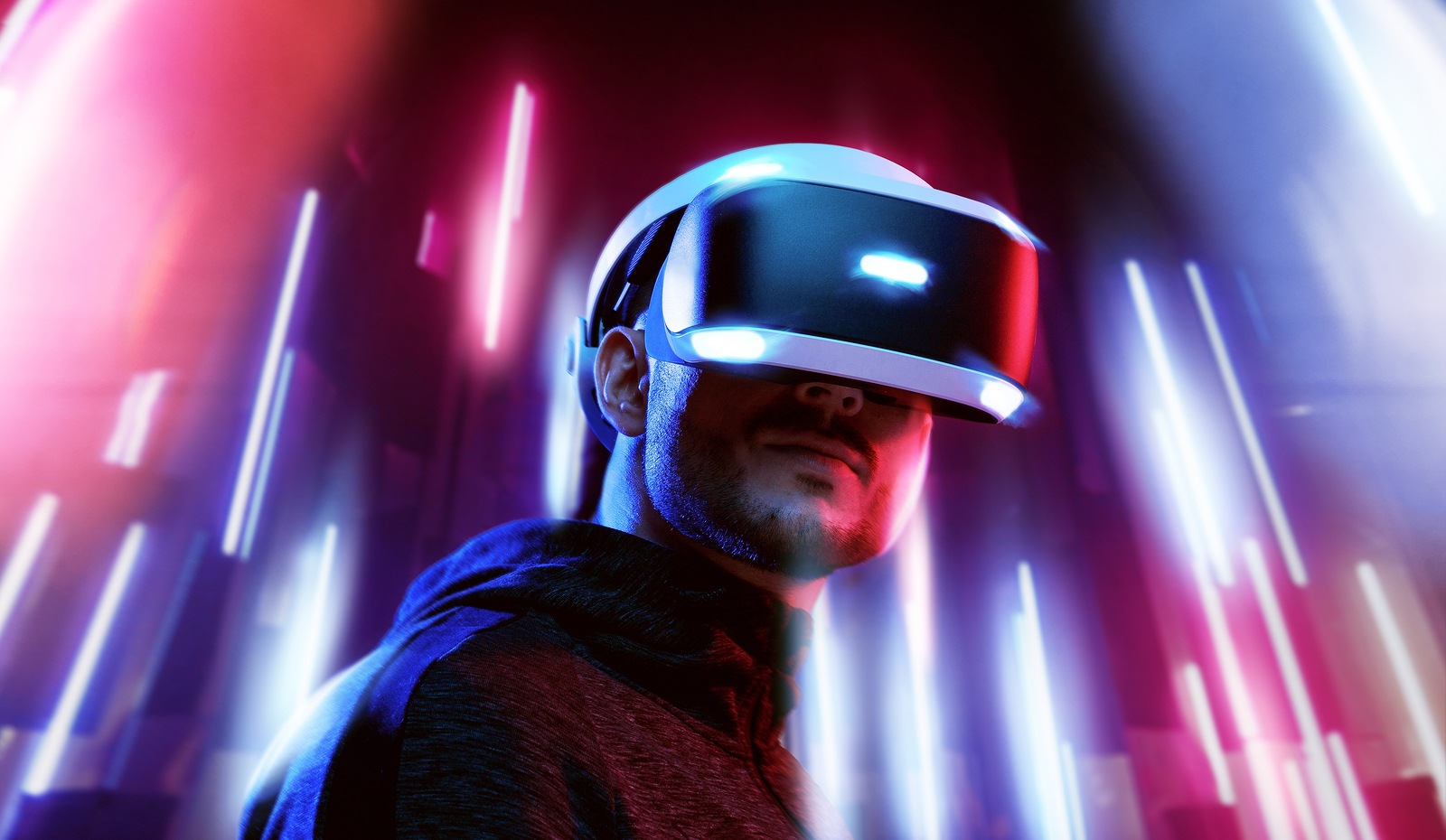 Model young man with beard in glasses of virtual reality. Augmented reality, science, future technology, people concept. VR. Futuristic 3d glasses with virtual projection. Neon light.