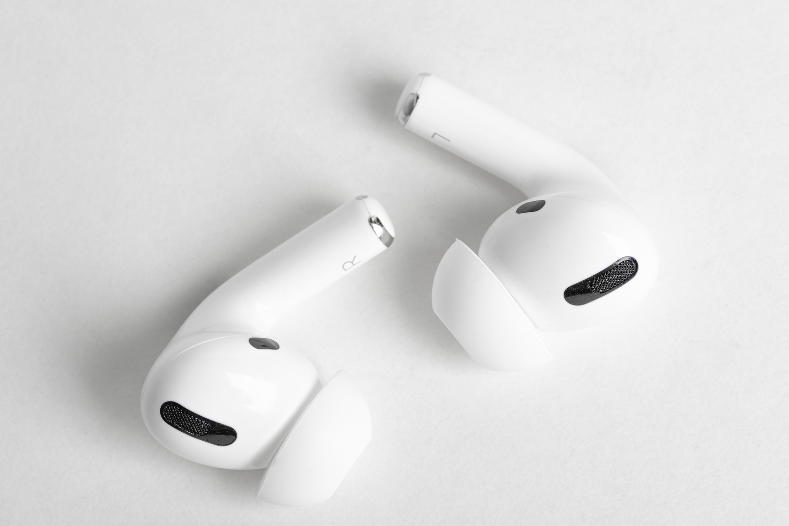 Vidalia, Georgia / USA - December 14, 2019 - A studio product shot of a pair of Apple AirPods Pro buds set on a plain light color background.