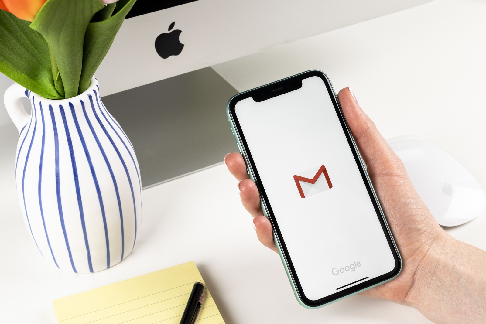 Helsinki, Finland, January 28, 2020: Google Gmail application icon on Apple iPhone X smartphone screen close-up in woman hands. Gmail app icon. Social media icon