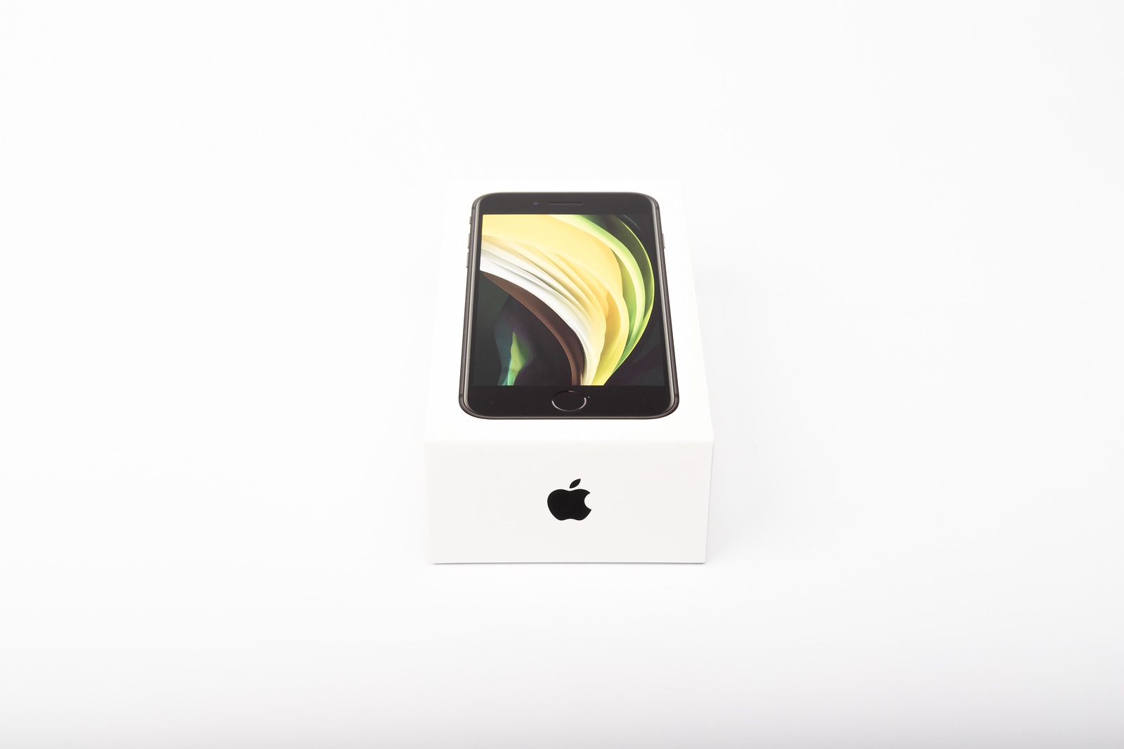 Paris, France - May 14, 2020: packaging of the new black iPhone SE 2020 from the multinational company Apple during the days of its studio release on a white background