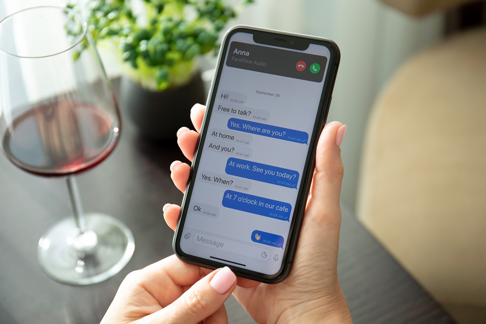 Alanya, Turkey - July 10, 2020: Woman hand holding iPhone 11 with phone call widget on the home screen. iPhone 11 was created and developed by the Apple inc.