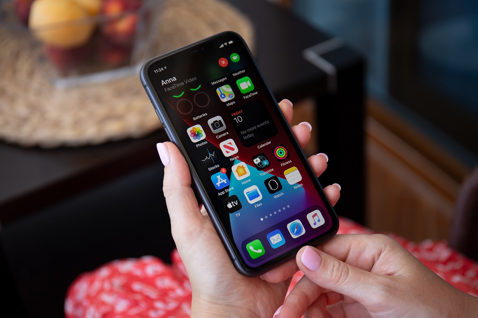 Alanya, Turkey - July 10, 2020: Woman hand holding iPhone 11 with phone call widget on the home screen. iPhone 11 was created and developed by the Apple inc.