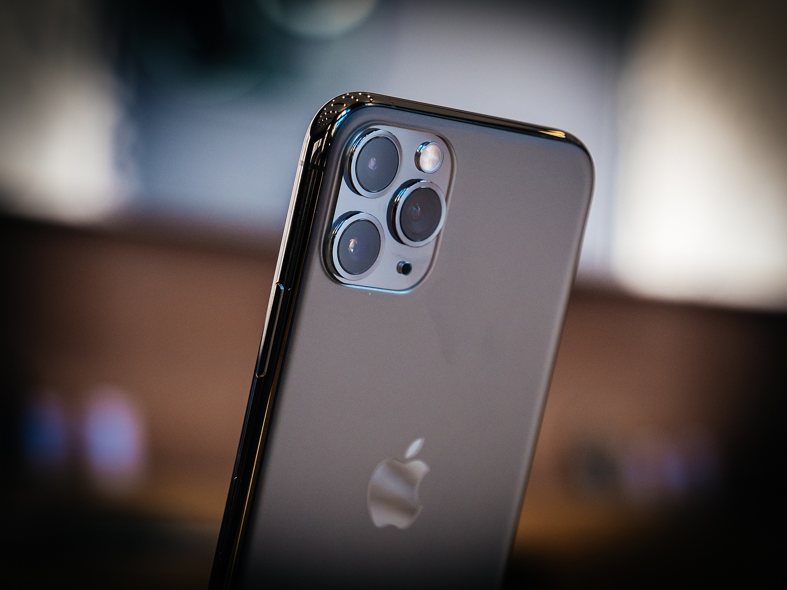 Paris, France - Sep 20, 2019: Close-up of the rear view of the new iPhone 11 Pro Pro Max with triple-camera in Apple Store on the day smartphone by Apple Computers goes on sale