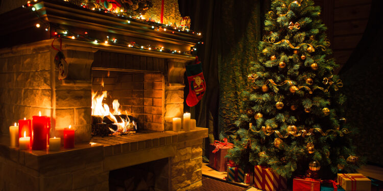 Living room home interior with decorated fireplace and christmas tree