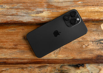 Uzhgorod, Ukraine - May 05, 2023: New Apple iPhone 14 Pro Max Space Black on a wooden background.