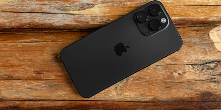 Uzhgorod, Ukraine - May 05, 2023: New Apple iPhone 14 Pro Max Space Black on a wooden background.